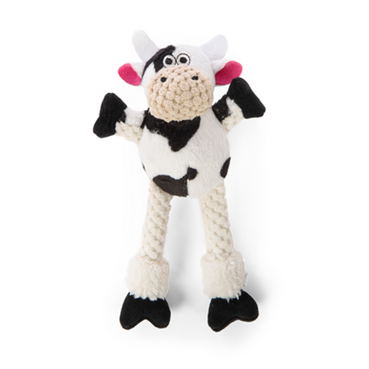 Cow-shaped knitted toy on a white background