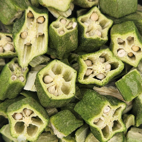 Close-up of sliced green okra pods with seeds inside.