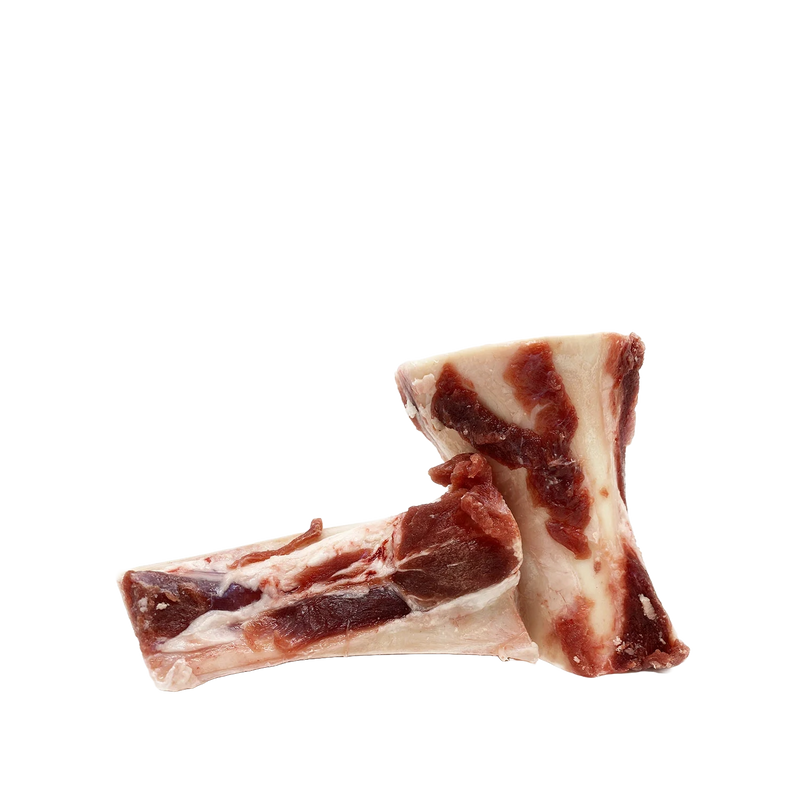 Load image into Gallery viewer, Two raw beef bones on a white background
