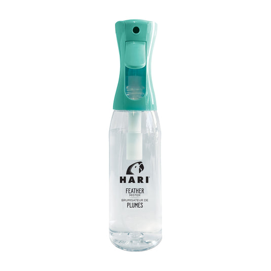 Clear spray bottle with teal top on a white background, featuring the brand 'Hari'.